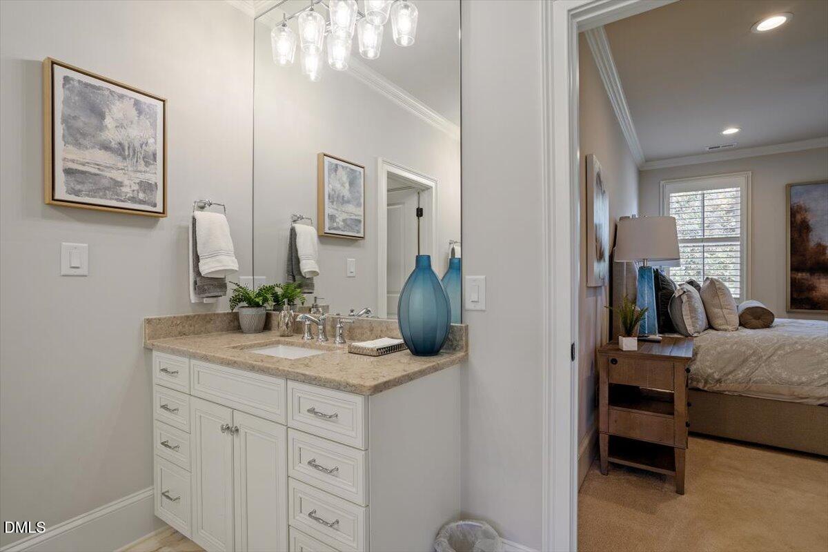 1413 Lily Estates Drive Raleigh, NC 27614 - Photo 59 of 82 a en suite bathroom with a granite countertop sink and a mirror