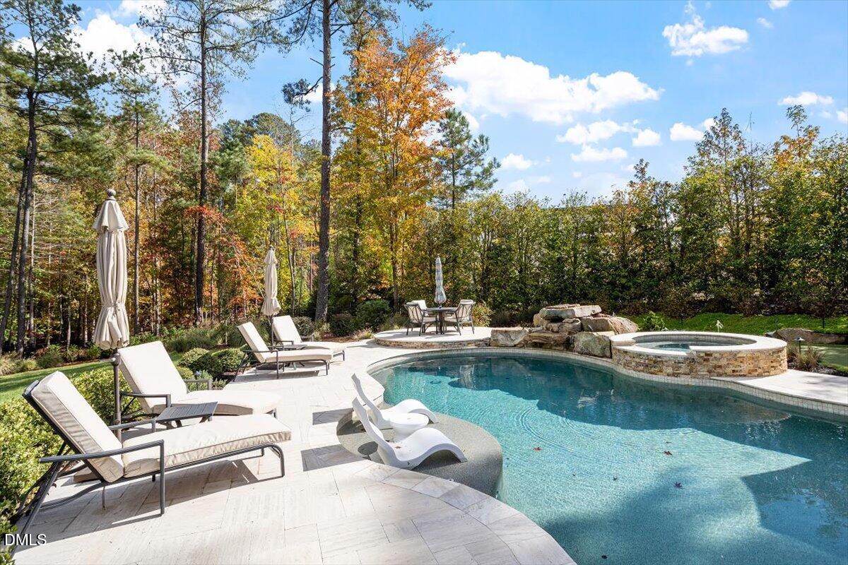 1413 Lily Estates Drive Raleigh, NC 27614 - Photo 72 of 82 a view of swimming pool with chairs and fire pit