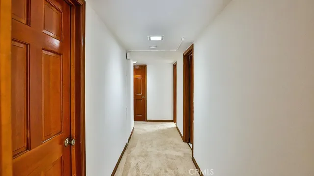 a view of hallway with livingroom