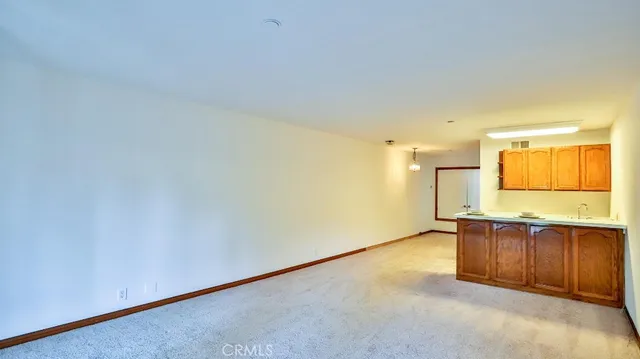 a view of a kitchen with wooden floor