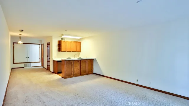 a view of a room with a fireplace and bathroom