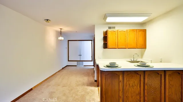 a bathroom with a sink a mirror and a shower