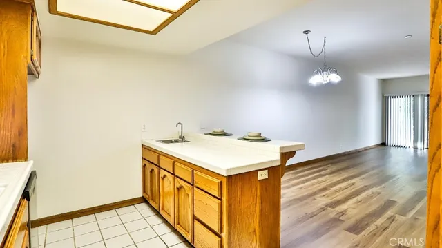 a kitchen that has a sink and a stove