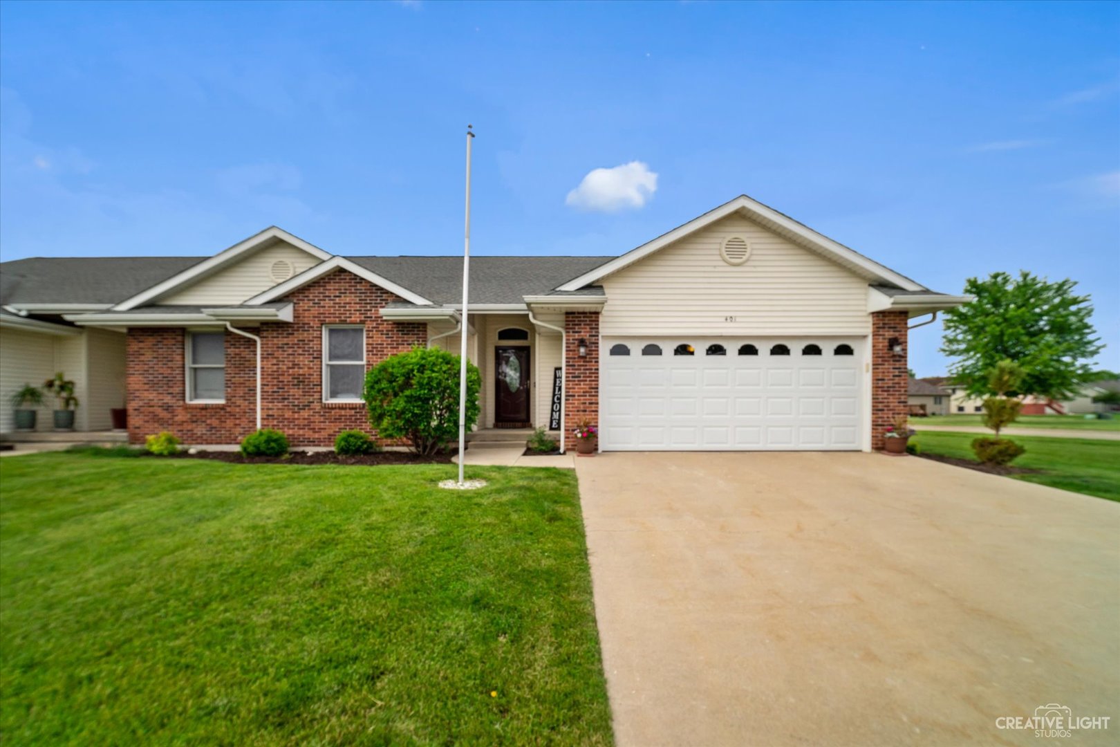 401 Lake Lida Lane Rochelle, IL 61068 - Photo 1 of 20 a front view of a house with a yard and garage