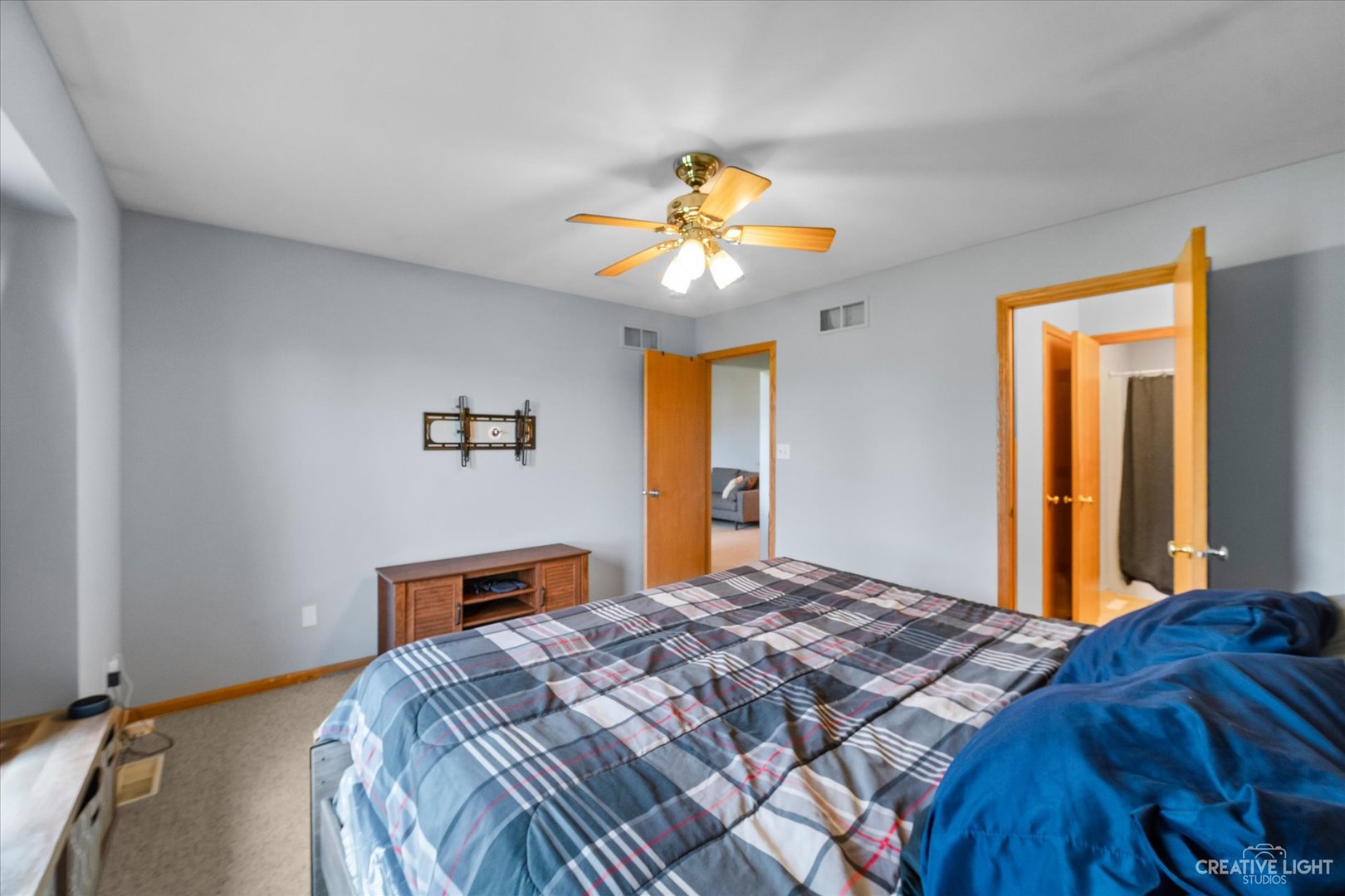 401 Lake Lida Lane Rochelle, IL 61068 - Photo 11 of 20 a bedroom with a bed and a chandelier