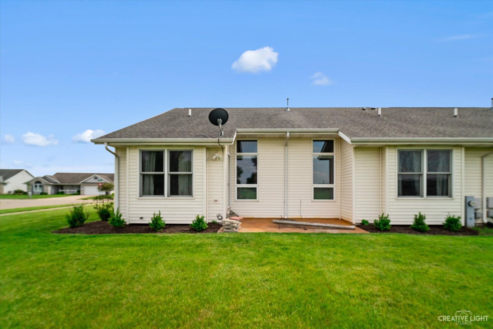 401 Lake Lida Lane Rochelle, IL 61068 - Photo 18 of 20 a front view of house with yard and green space