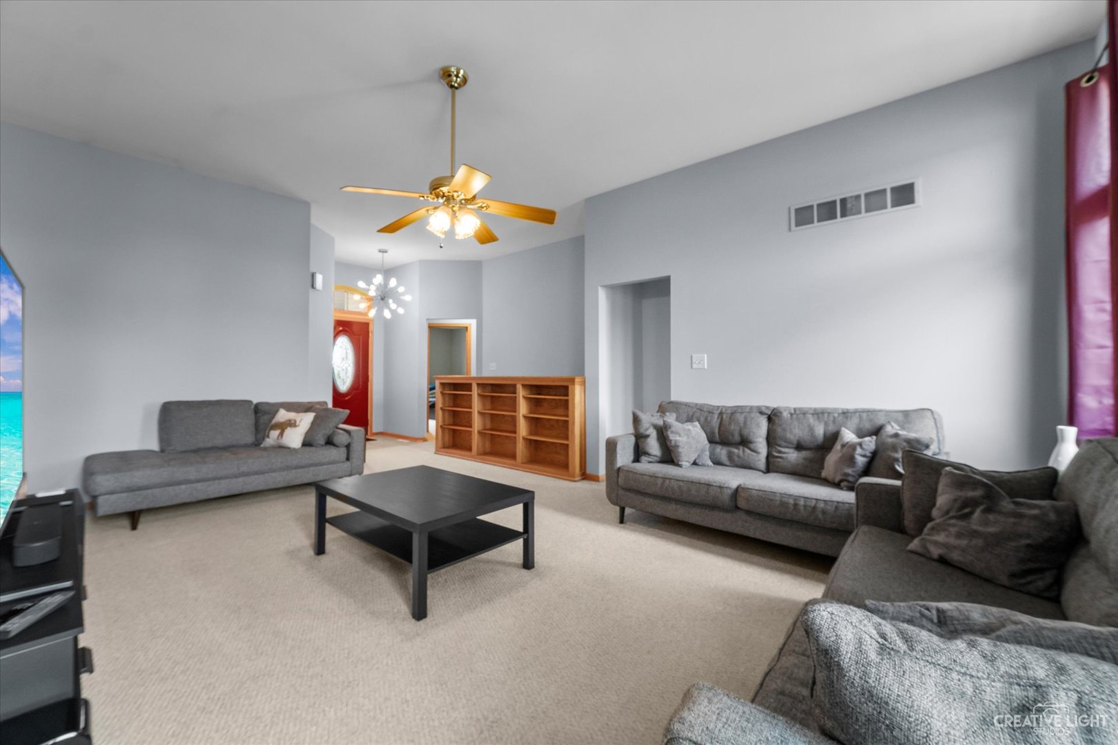 401 Lake Lida Lane Rochelle, IL 61068 - Photo 4 of 20 a living room with furniture and a chandelier