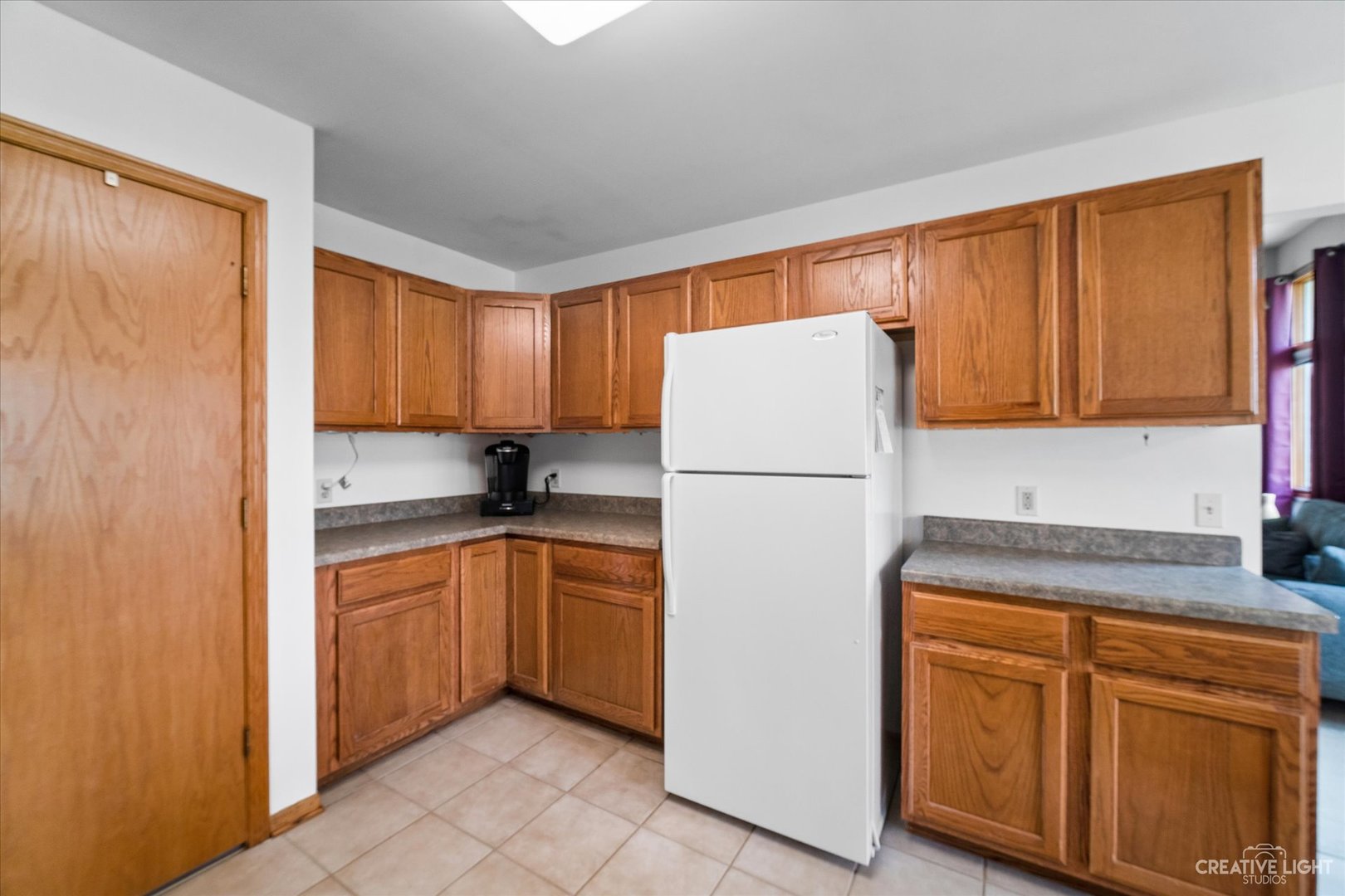 401 Lake Lida Lane Rochelle, IL 61068 - Photo 8 of 20 a kitchen with sink a refrigerator and cabinets