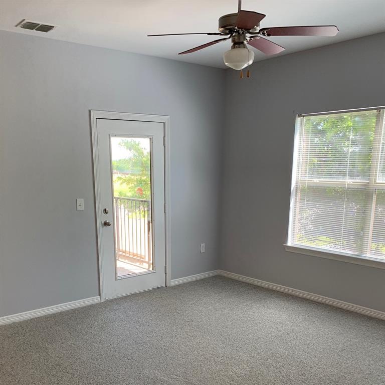 101 South Alabama Street, Unit 11 Celina, TX 75009 - Photo 6 of 8 an empty room with windows and fan