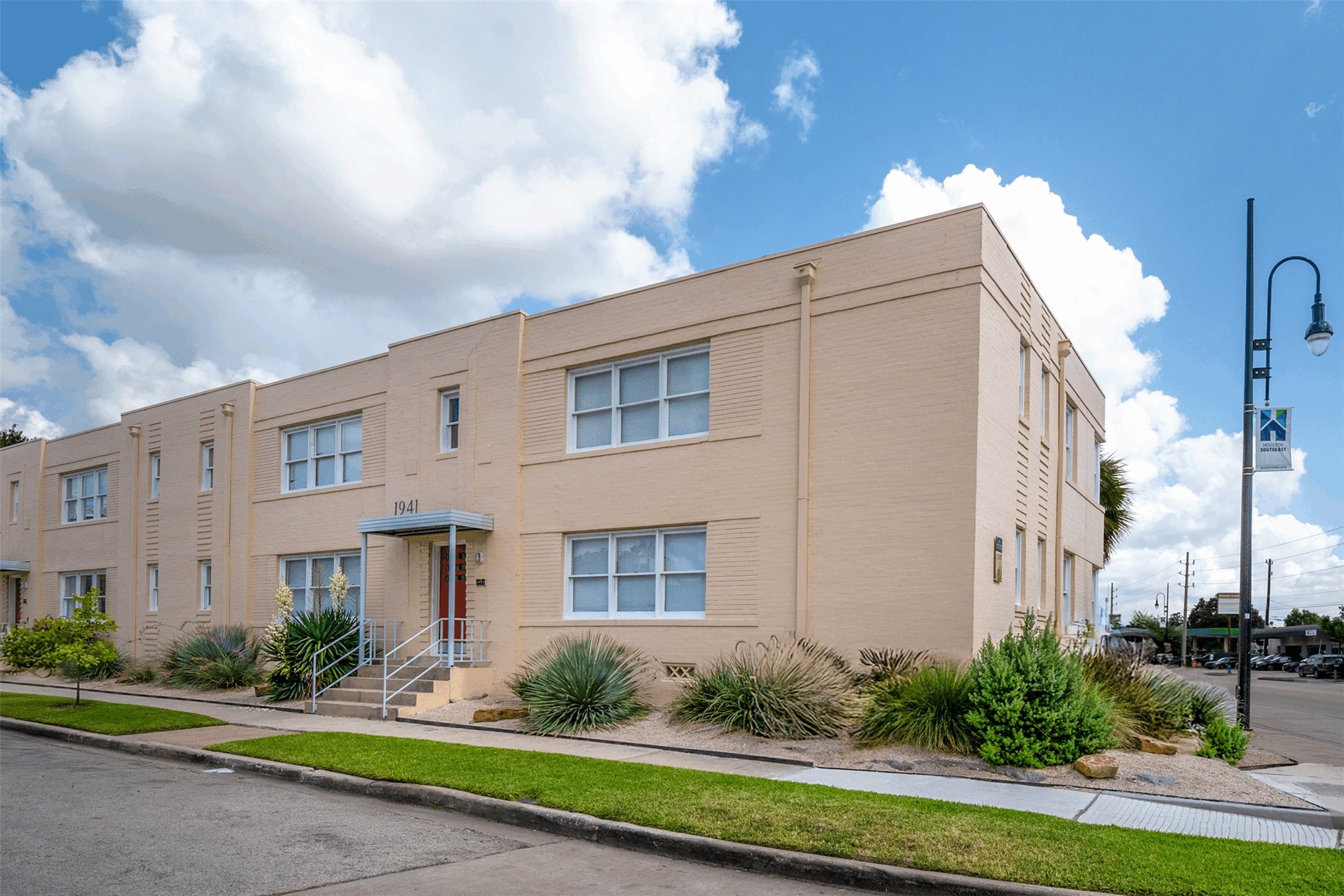 1917 Prospect Street, Unit 1 Houston, TX 77004 - Photo 1 of 16 a view of a white house next to a yard
