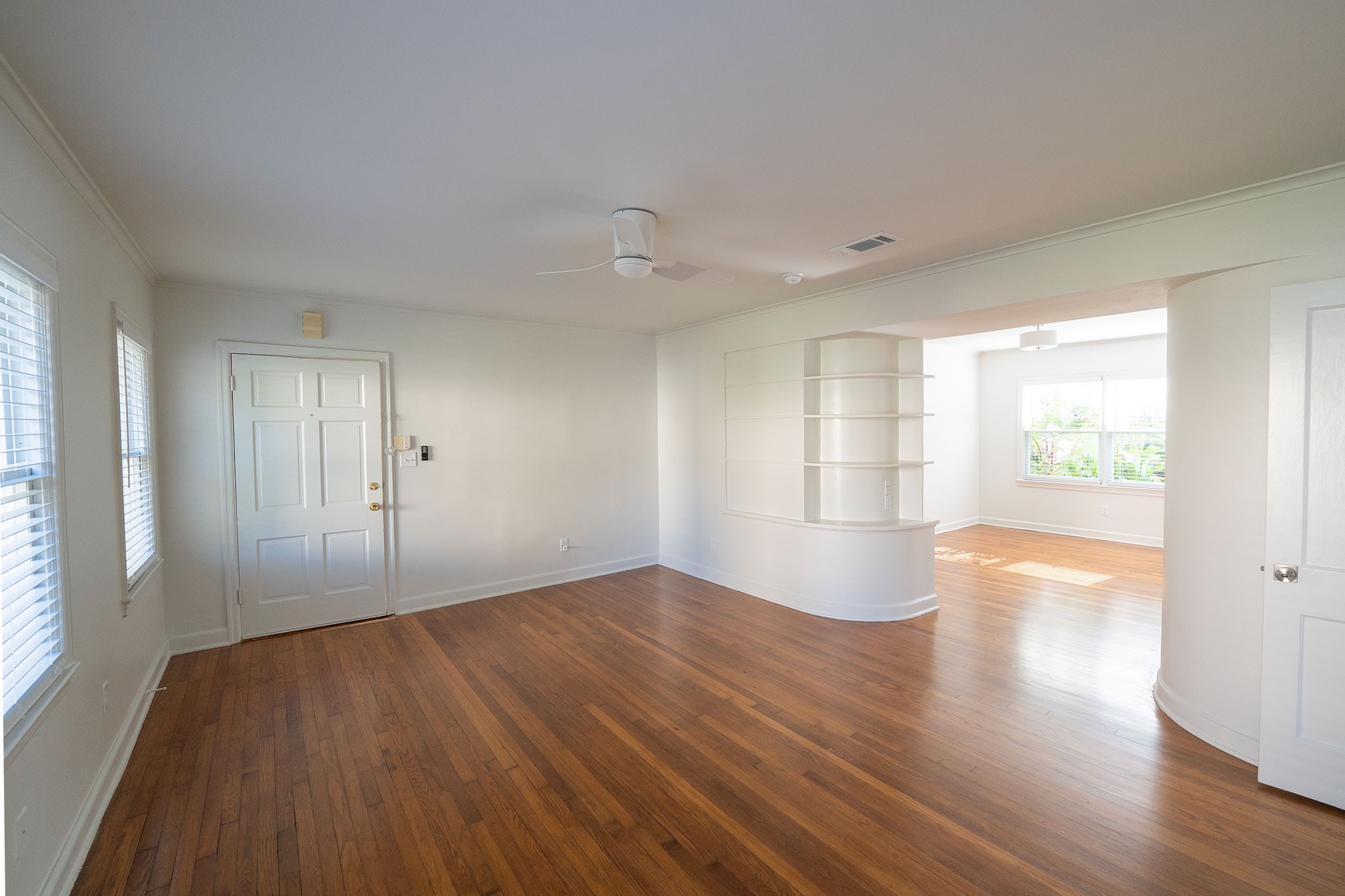 1917 Prospect Street, Unit 1 Houston, TX 77004 - Photo 5 of 16 a view of empty room with wooden floor and fan