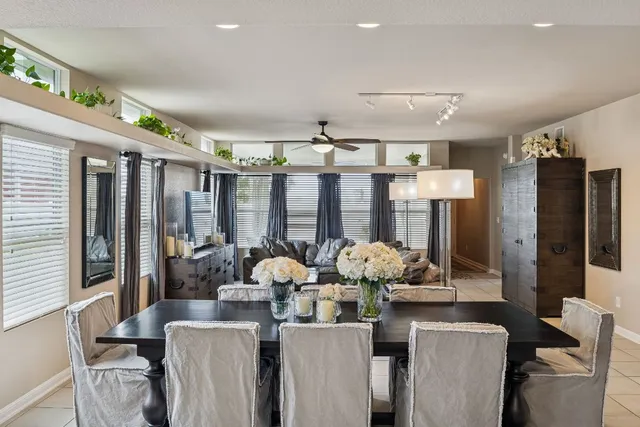 a living room with furniture and chandelier