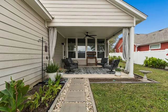 a outdoor living space with furniture and a rug
