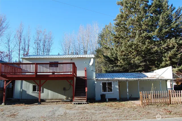 a view of a house next to a yard