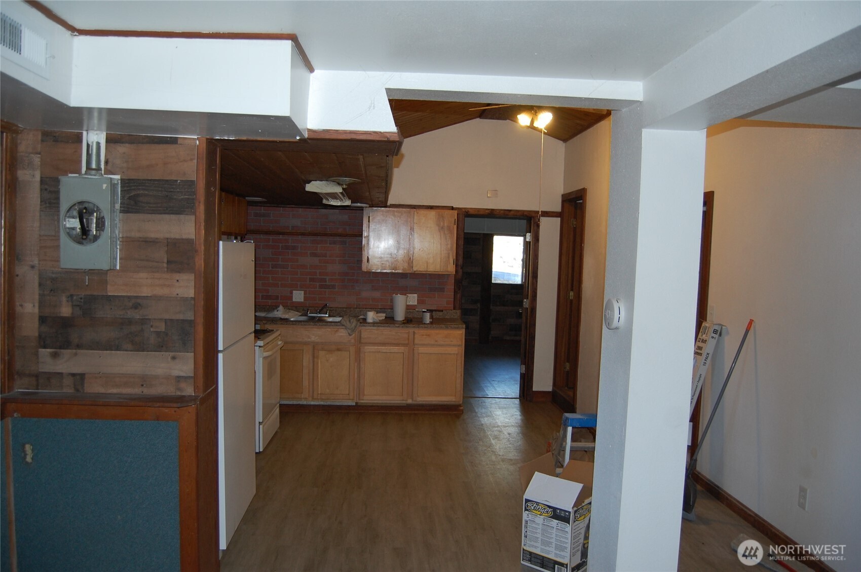 117 Lake Street Conconully, WA 98819 - Photo 4 of 10 a kitchen with a refrigerator and a sink