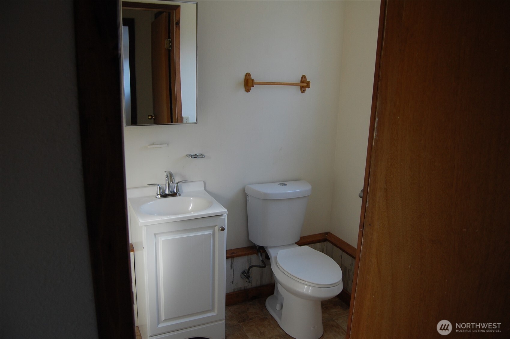 117 Lake Street Conconully, WA 98819 - Photo 8 of 10 a white toilet sitting next to a bathroom sink