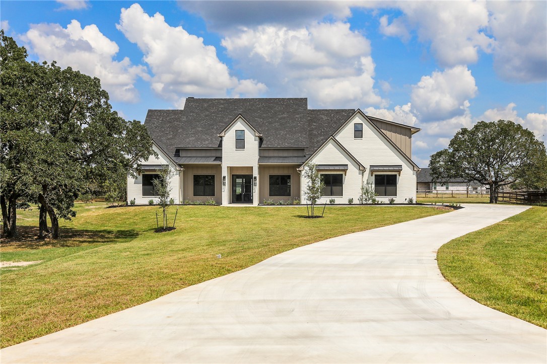 7933 Stiteler Drive Bryan, TX 77808 - Photo 1 of 44 a front view of house with yard and green space