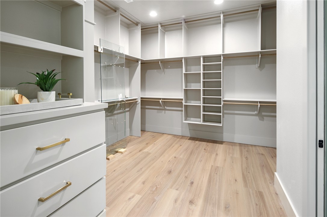 7933 Stiteler Drive Bryan, TX 77808 - Photo 32 of 44 a kitchen with a refrigerator and white cabinets