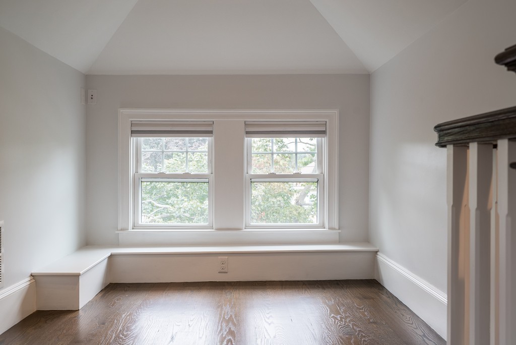 49 Fuller Road, Unit 2 Watertown, MA 02472 - Photo 12 of 23 a view of room with wooden floor and windows