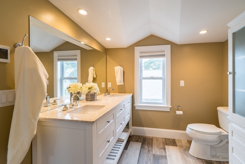 49 Fuller Road, Unit 2 Watertown, MA 02472 - Photo 15 of 23 a bathroom with a double vanity sink toilet and shower