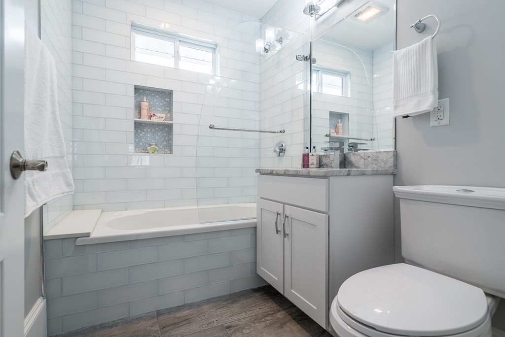49 Fuller Road, Unit 2 Watertown, MA 02472 - Photo 8 of 23 a bathroom with a sink a toilet and bathtub