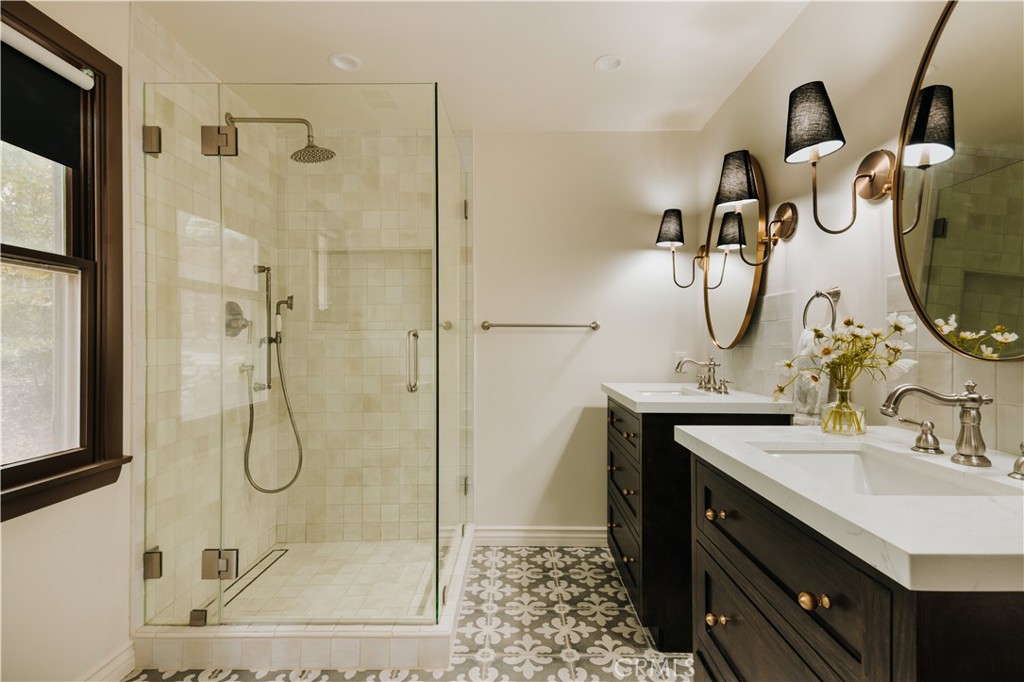 22771 Crest Forest Drive Crestline, CA 92325 - Photo 14 of 26 a bathroom with a sink mirror and shower