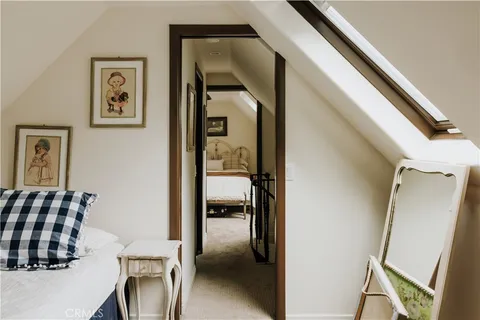 a view of livingroom with furniture and a hallway
