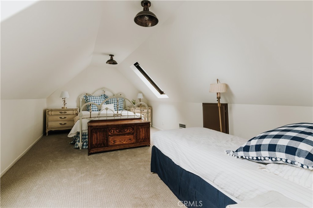 22771 Crest Forest Drive Crestline, CA 92325 - Photo 20 of 26 a bedroom with a bed and a dresser