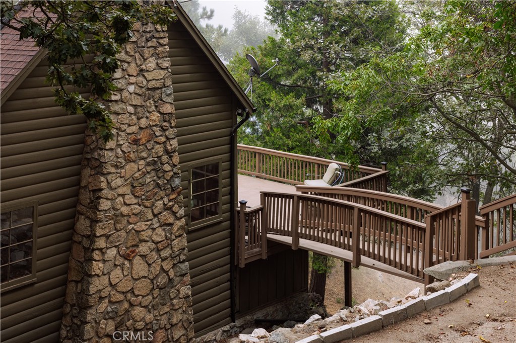 22771 Crest Forest Drive Crestline, CA 92325 - Photo 25 of 26 a view of deck with wooden floor and fence