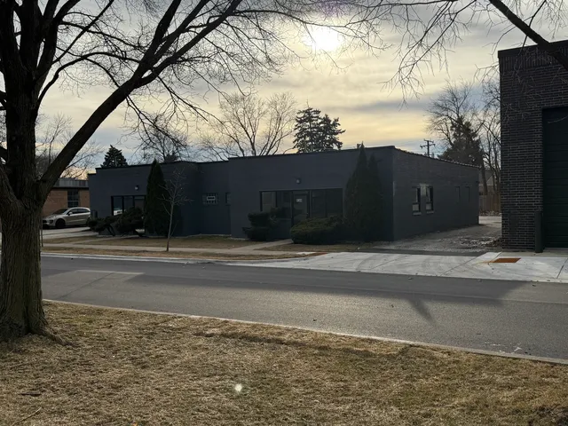 a view of a street with a building in the background