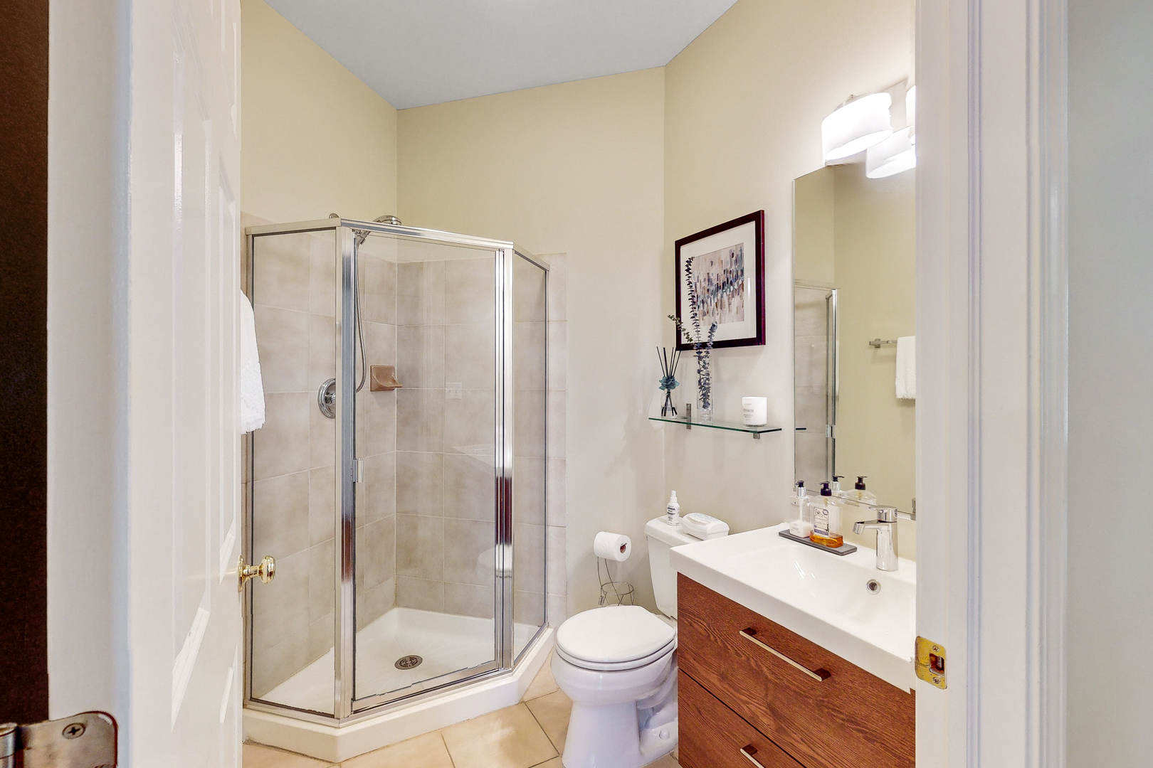 768 St Johns Place Addison, IL 60101 - Photo 16 of 34 a bathroom with a bathtub shower sink mirror and toilet