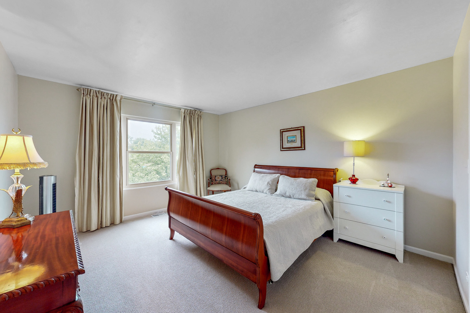 768 St Johns Place Addison, IL 60101 - Photo 17 of 34 a bedroom with a bed and a couch