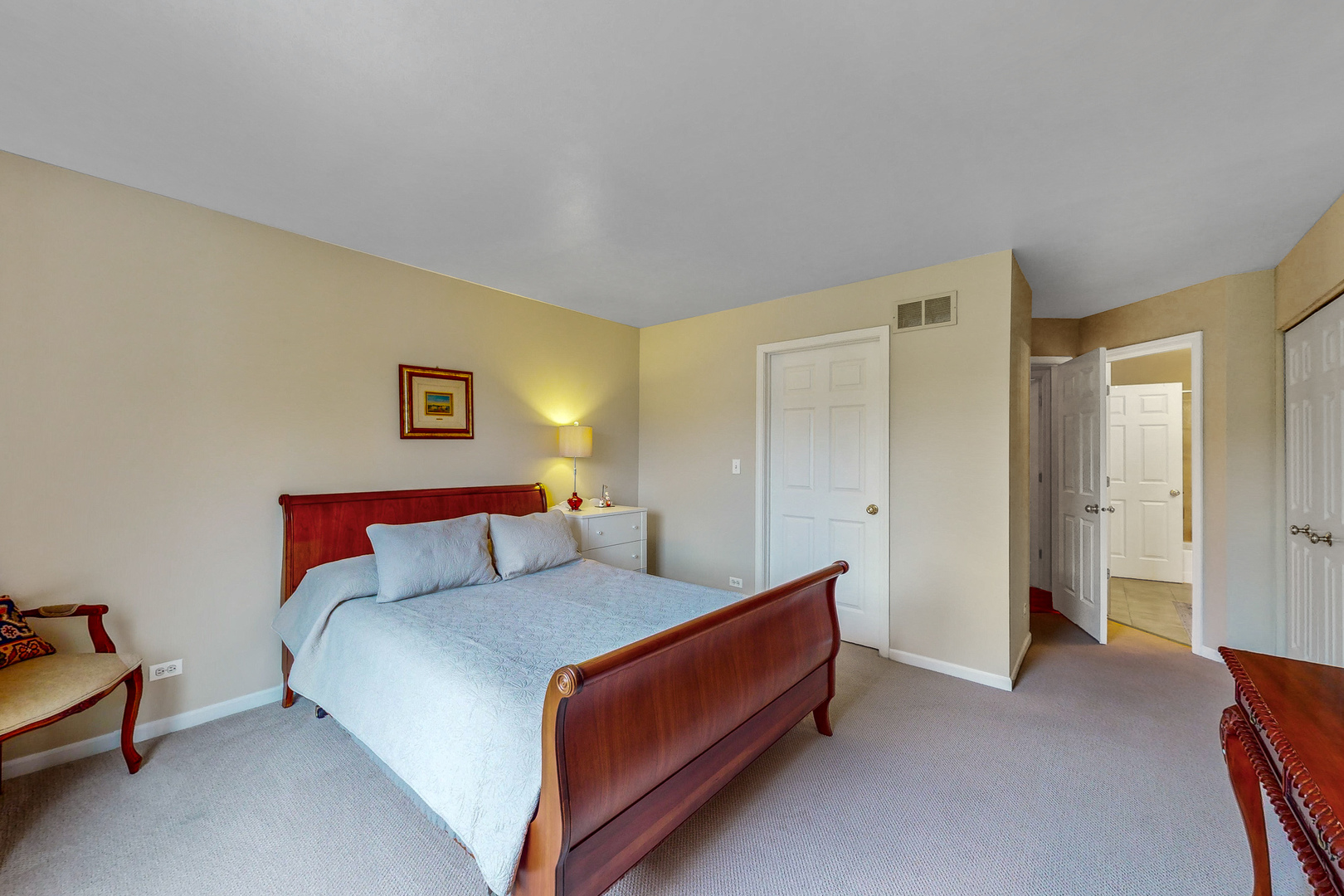 768 St Johns Place Addison, IL 60101 - Photo 18 of 34 a bedroom with a bed and a lamp