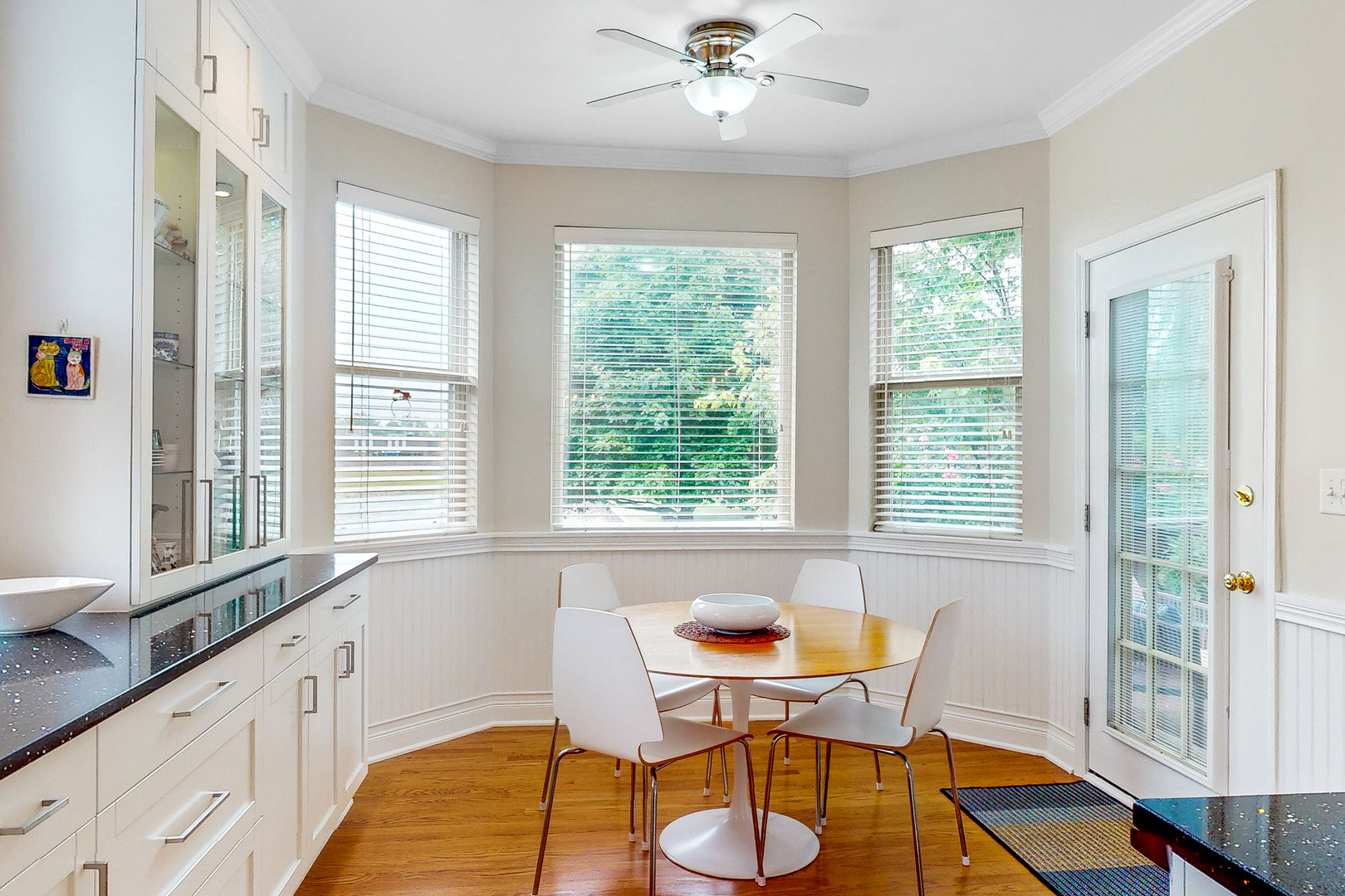 768 St Johns Place Addison, IL 60101 - Photo 7 of 34 a living room with a large window and dining table