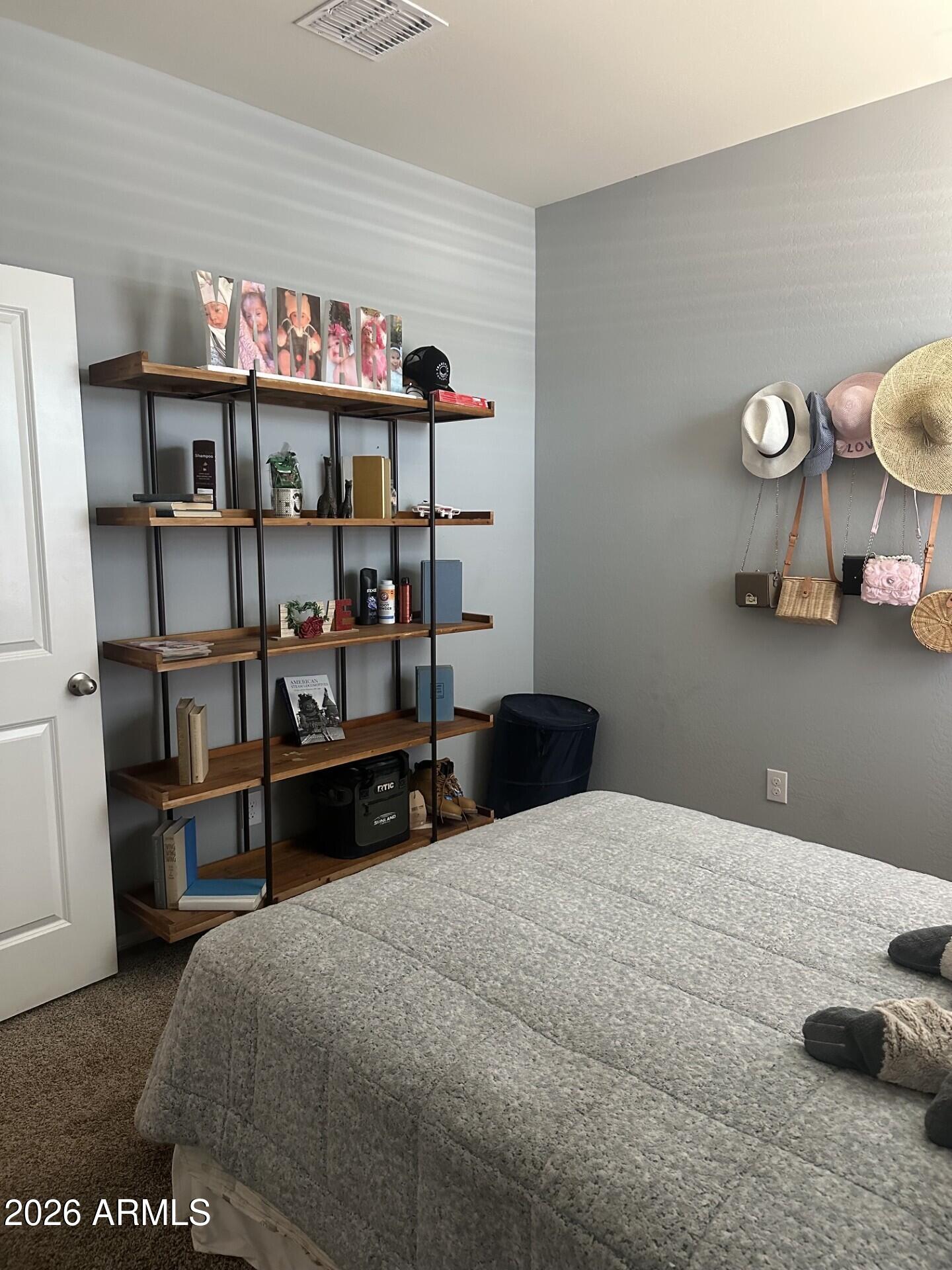 7851 West Riverside Avenue Phoenix, AZ 85043 - Photo 10 of 40 a bedroom with a bed and cabinets