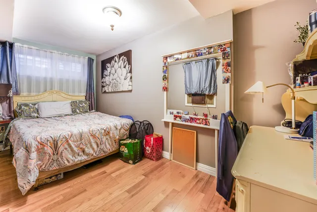 a bedroom with a bed and a tv