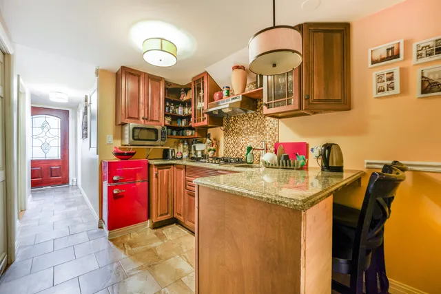 a kitchen with stainless steel appliances granite countertop a sink and cabinets