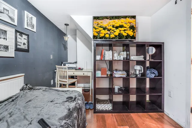 a bedroom with a bed and television