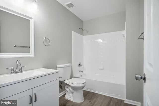 a bathroom with a toilet a sink and a bathtub