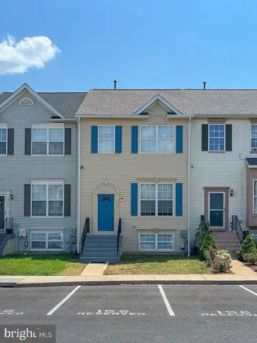 a front view of a house with a swimming pool