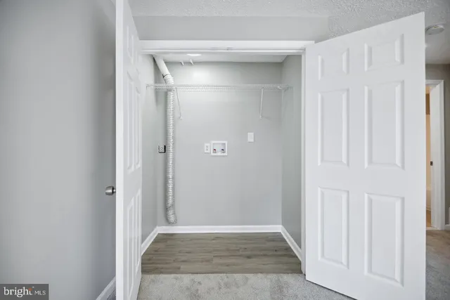 an empty room with wooden floor