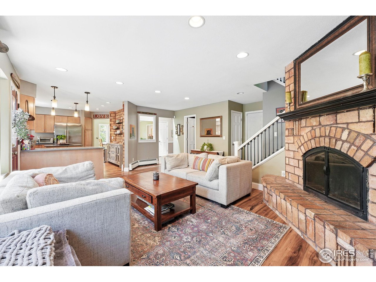 6850 Frying Pan Road Boulder, CO 80301 - Photo 11 of 40 Family room with a second wood burning fireplace and a bay window