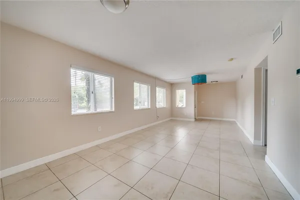 a view of an empty room with a window