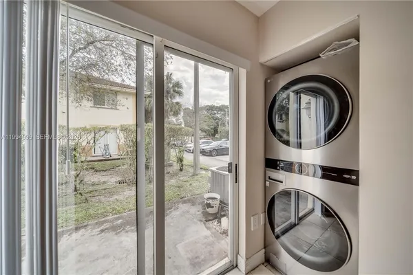 a room with window dryer and washer