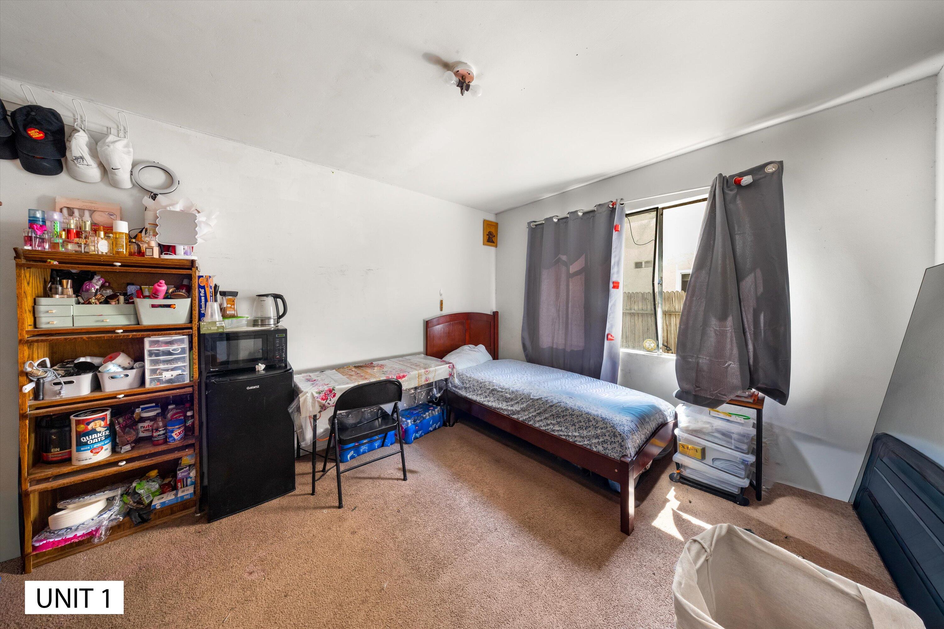 5859 Mandarin Drive Santa Barbara, CA 93117 - Photo 11 of 55 a bedroom with furniture and a book shelf