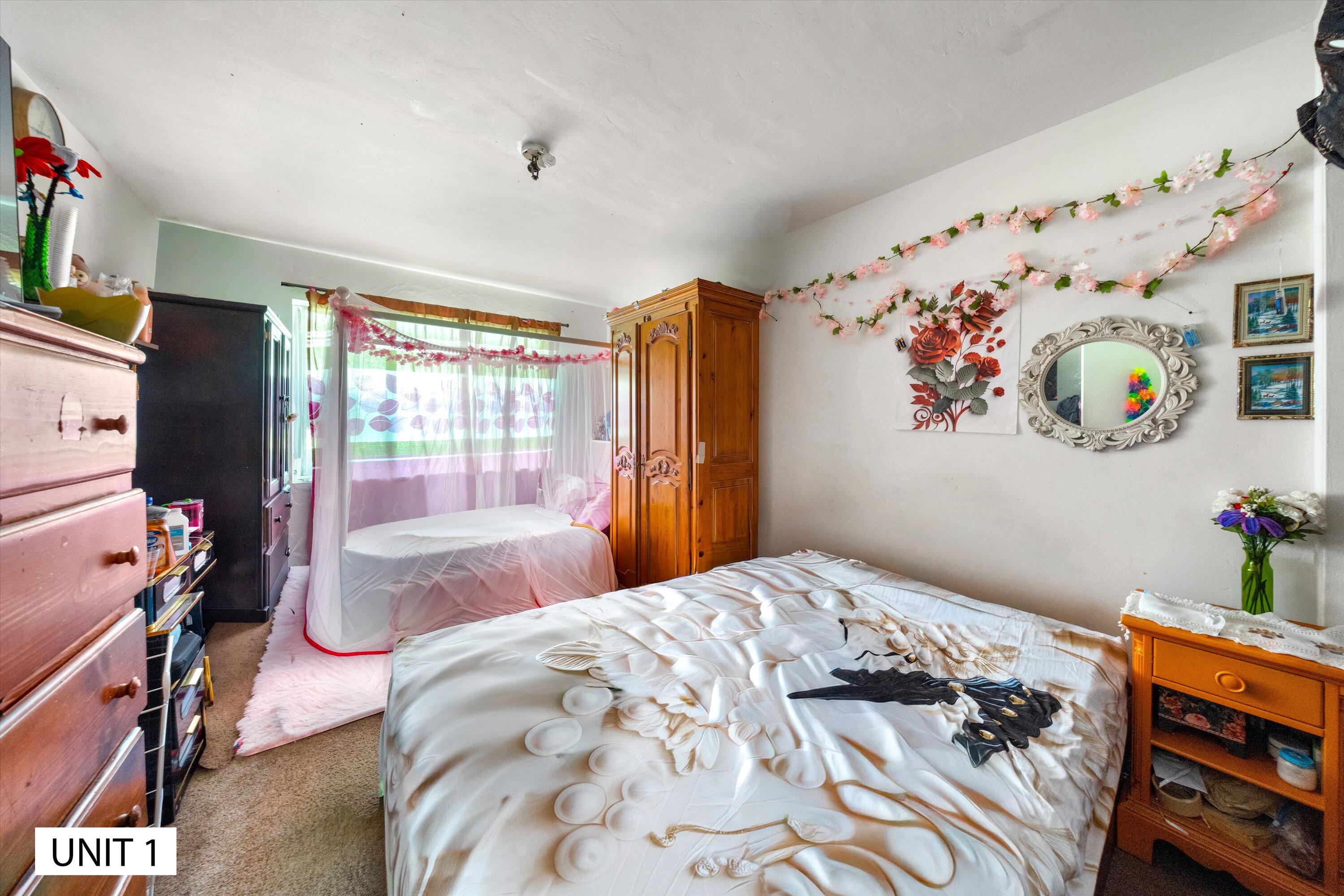 5859 Mandarin Drive Santa Barbara, CA 93117 - Photo 12 of 55 a bedroom with bed and large window