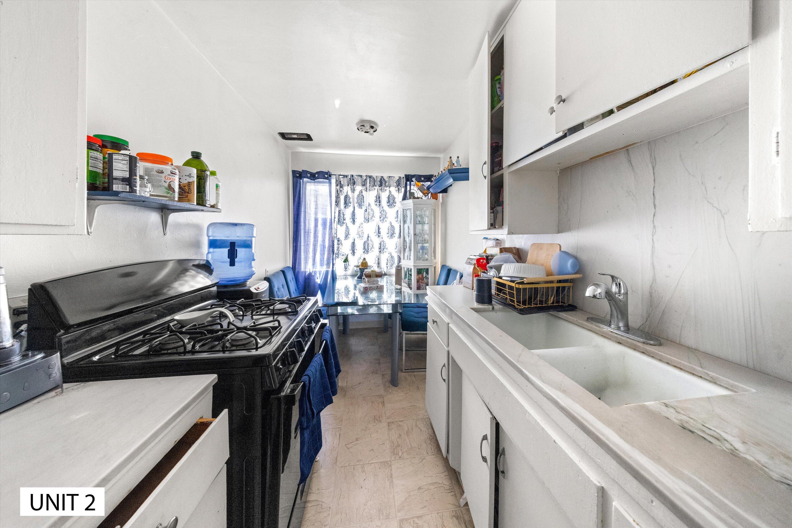 5859 Mandarin Drive Santa Barbara, CA 93117 - Photo 19 of 55 a kitchen with a stove a sink and a refrigerator