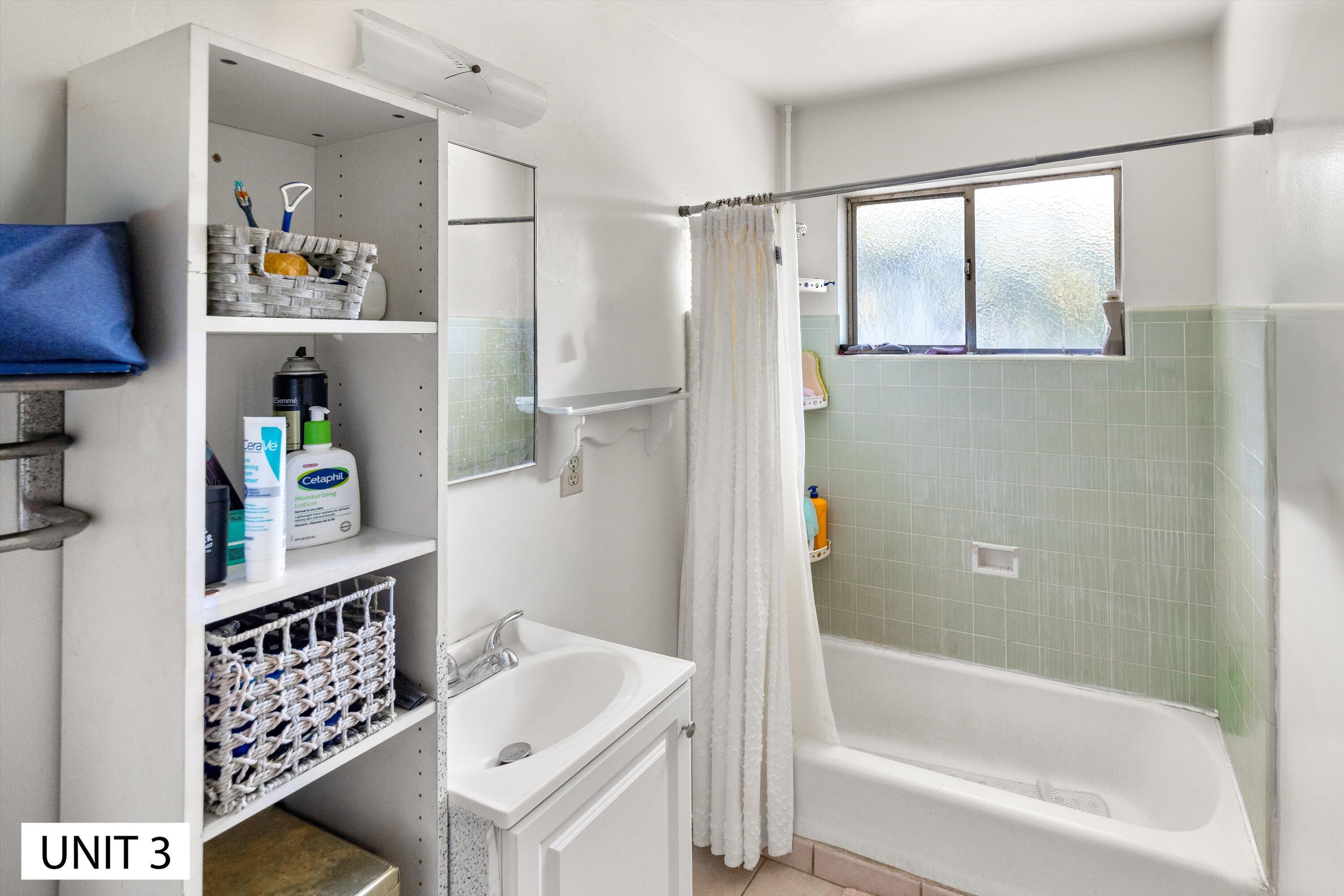 5859 Mandarin Drive Santa Barbara, CA 93117 - Photo 29 of 55 a bathroom with a bathtub a sink and a shower