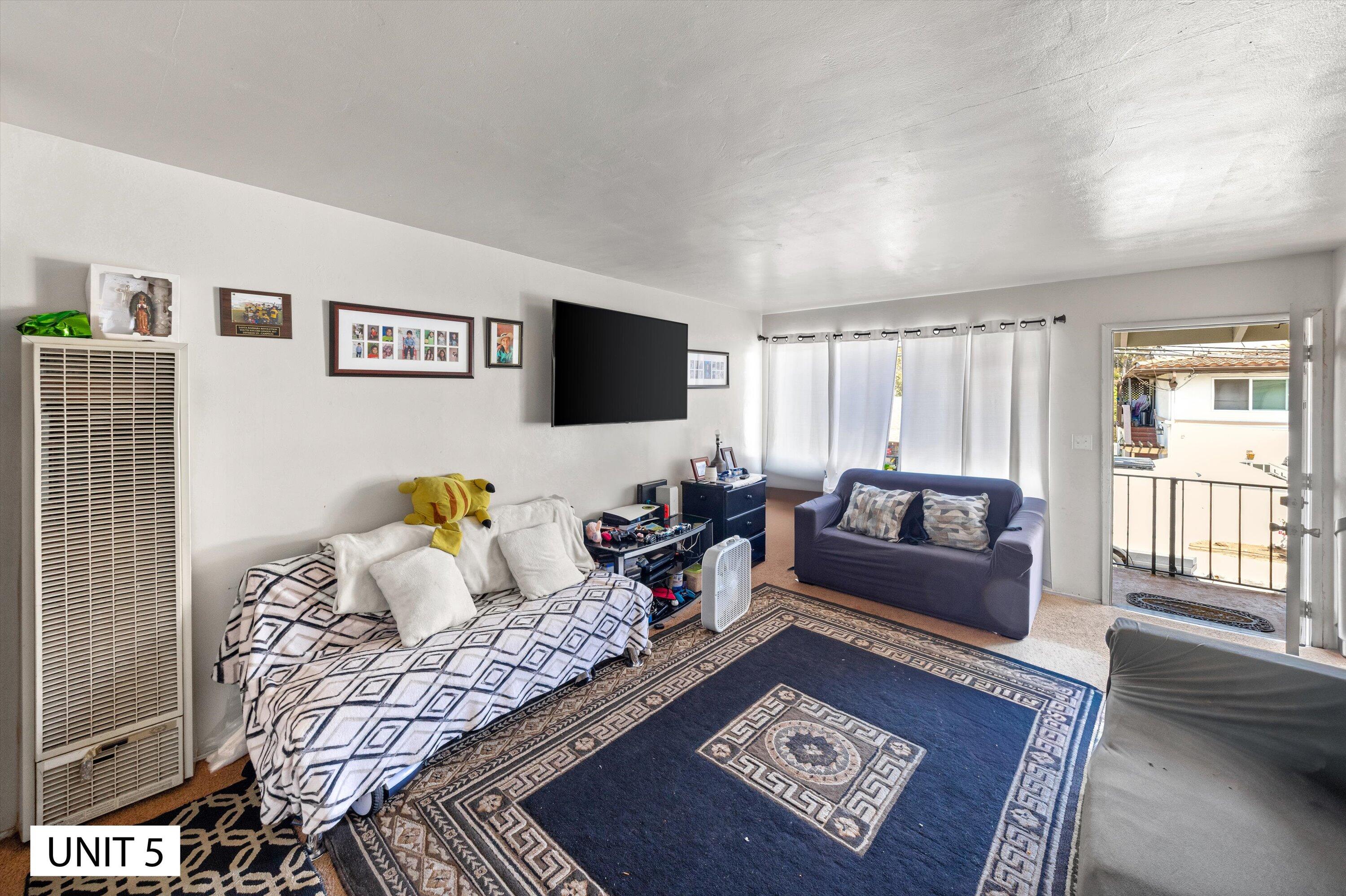 5859 Mandarin Drive Santa Barbara, CA 93117 - Photo 39 of 55 a living room with furniture and a flat screen tv