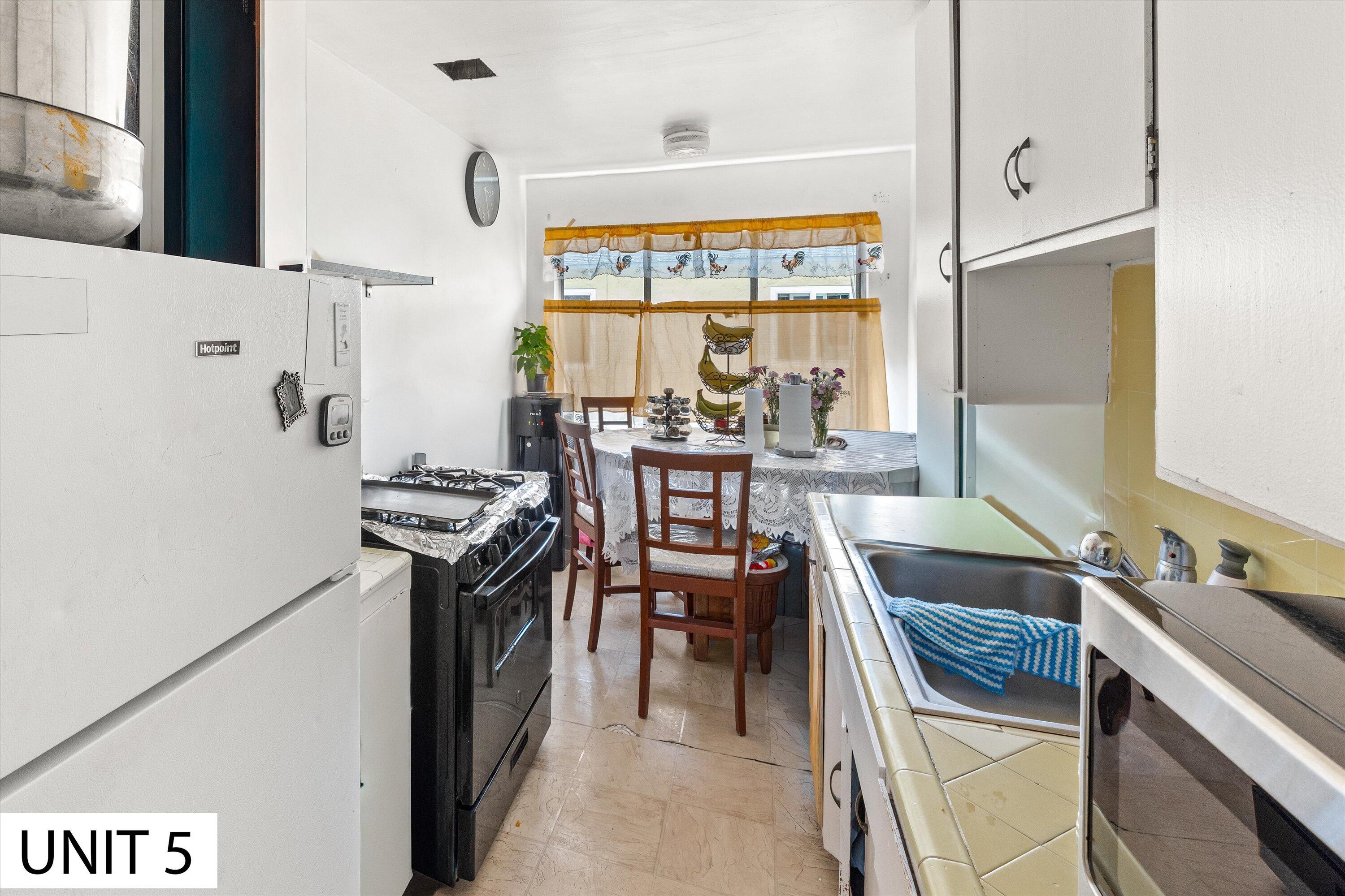 5859 Mandarin Drive Santa Barbara, CA 93117 - Photo 40 of 55 a kitchen with stainless steel appliances granite countertop a stove and a refrigerator